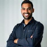 Omar Hassan, a technician, with a confident smile