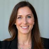 Sarah Davis, a technology leader, looking pleased